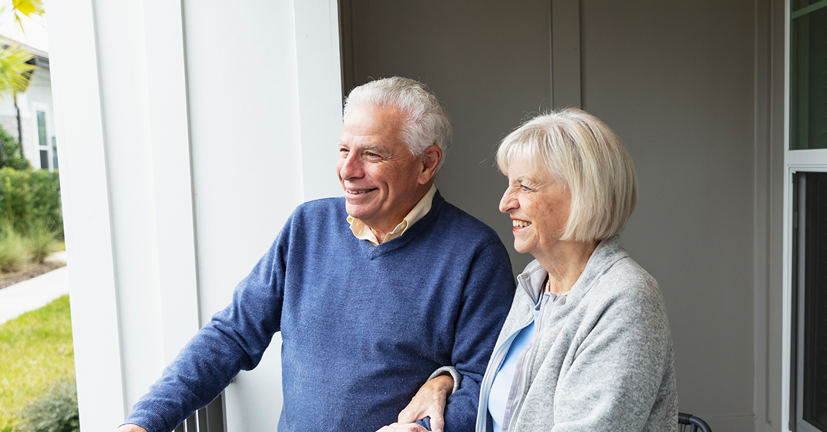 A cheerful portrait showcasing a radiant elderly couple, a man and a woman, brimming with happiness.