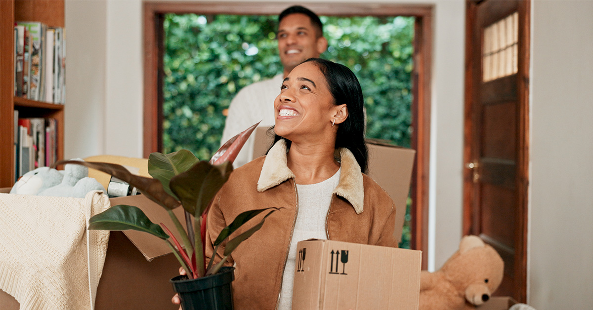 A couple moving into their first home